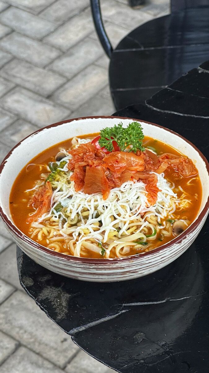 Close view of ramen and kimchi at EMC Kitchen in Surat