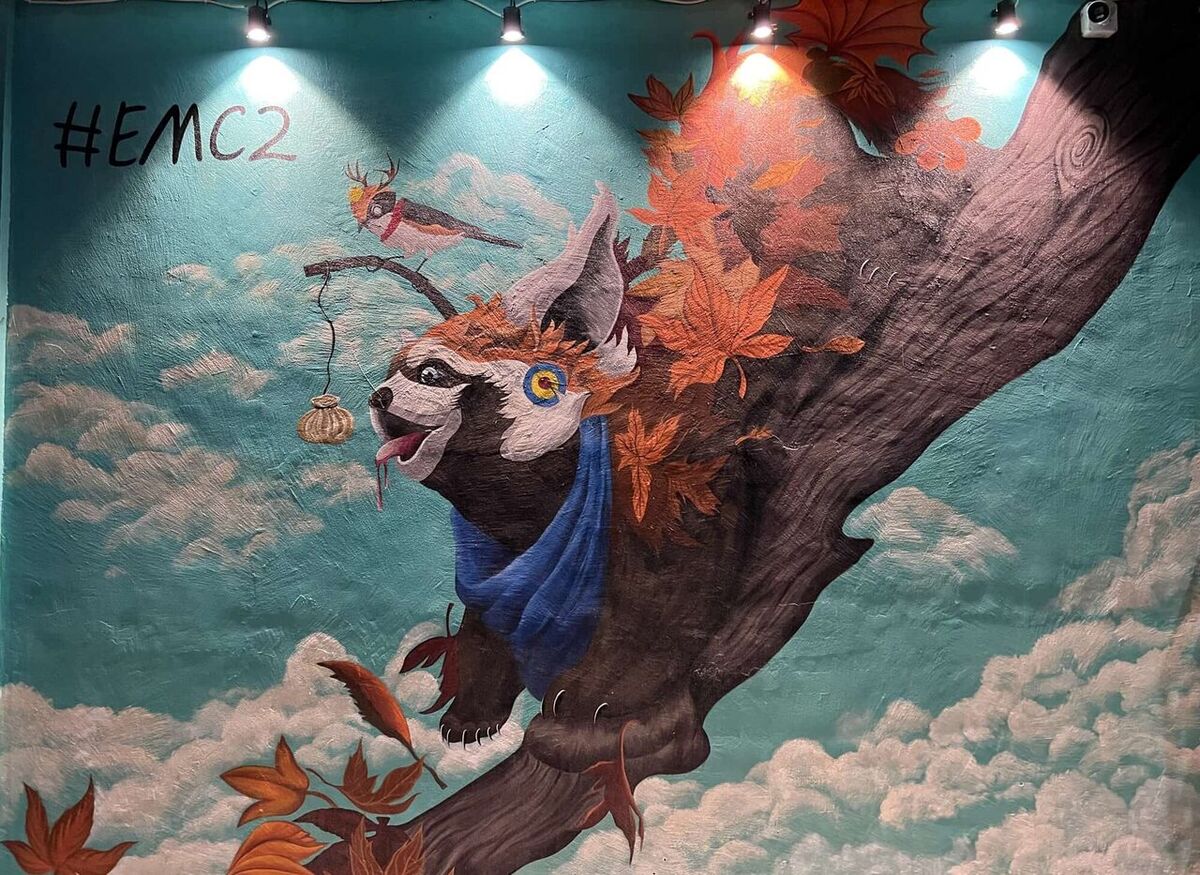 EMC Kitchen restaurant mural and dining atmosphere in Vesu, Surat